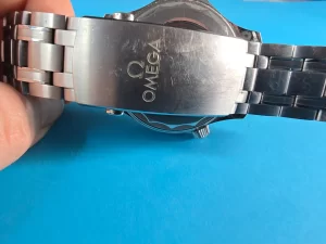 Buckle of Omega Seamaster with Omega logo 